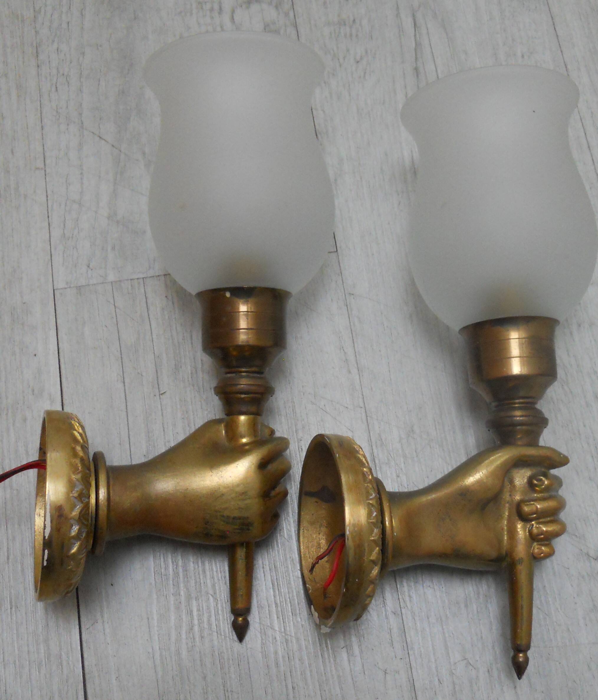 Pair of golden bronze flambeau sconces