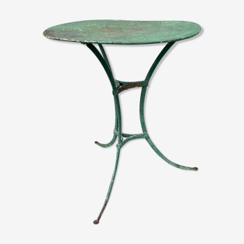 Riveted green old garden pedestal table