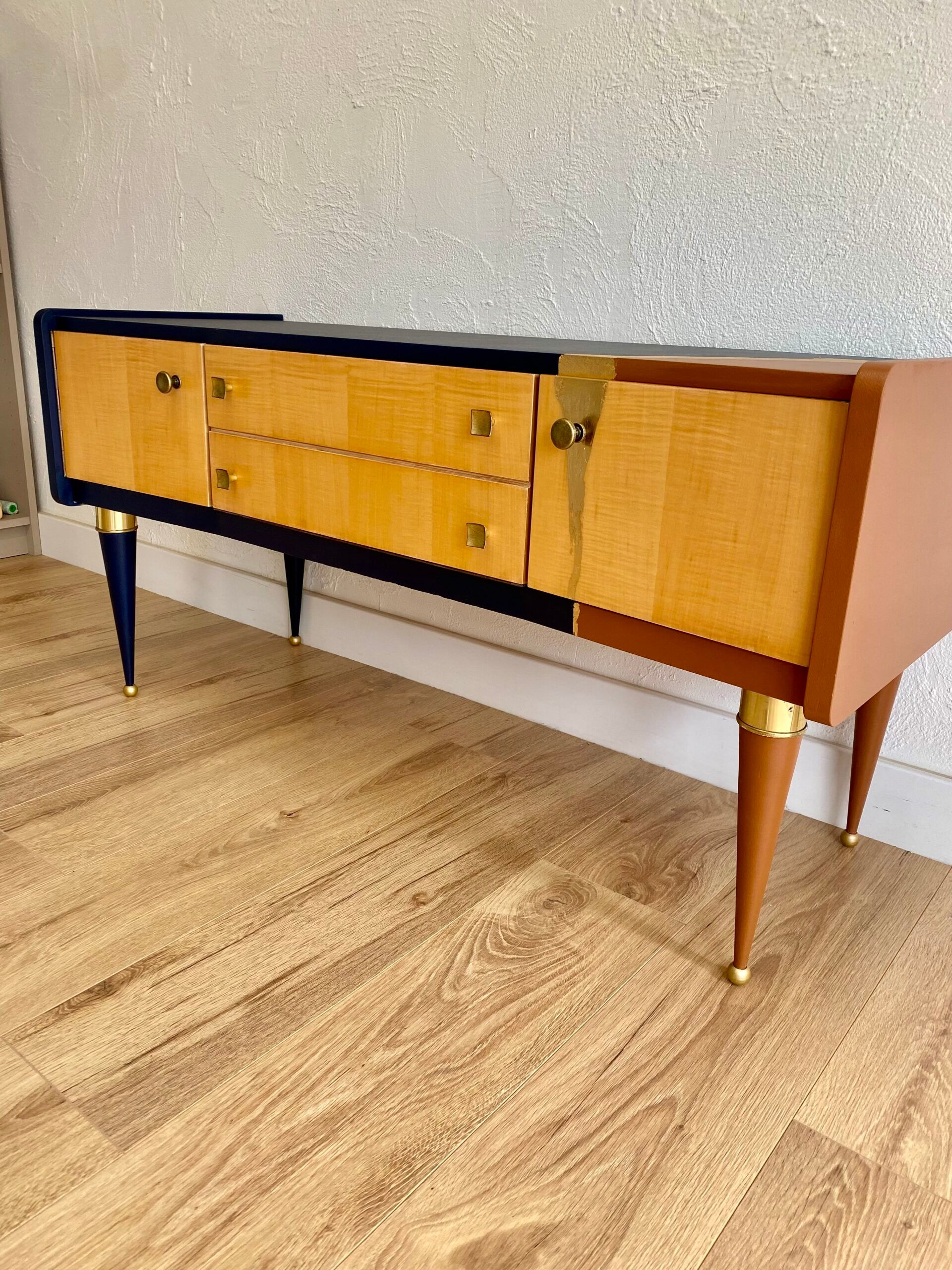 Vintage furniture revamped in navy blue, terracotta, and gold leaf – Reimagined mid-century style.