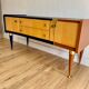 Vintage furniture revamped in navy blue, terracotta, and gold leaf – Reimagined mid-century style.
