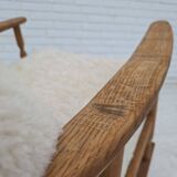 1970s, Danish rocking chair, reupholstered in quality genuine sheepskin.