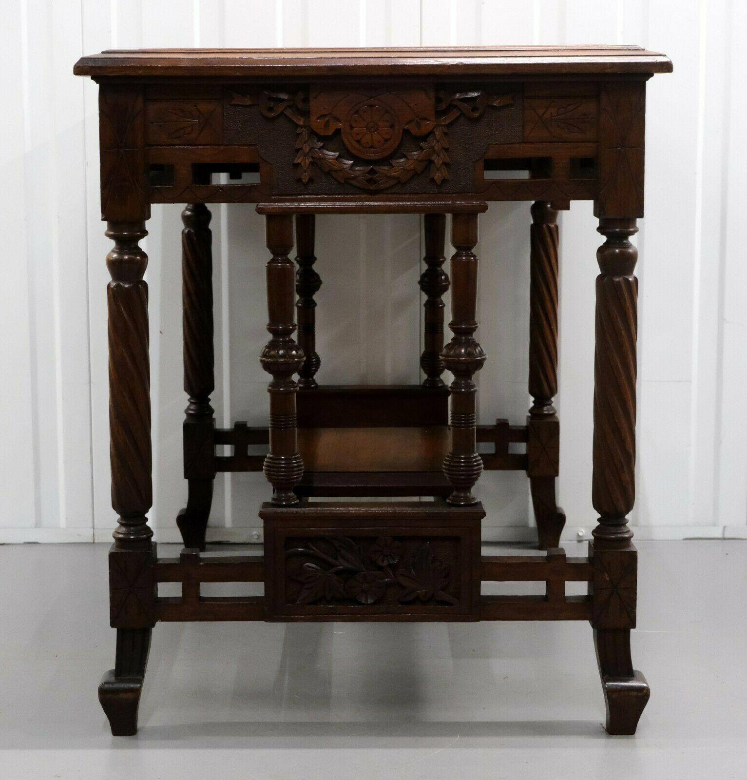 19th-century carved walnut desk with a leather top.