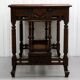 19th-century carved walnut desk with a leather top.