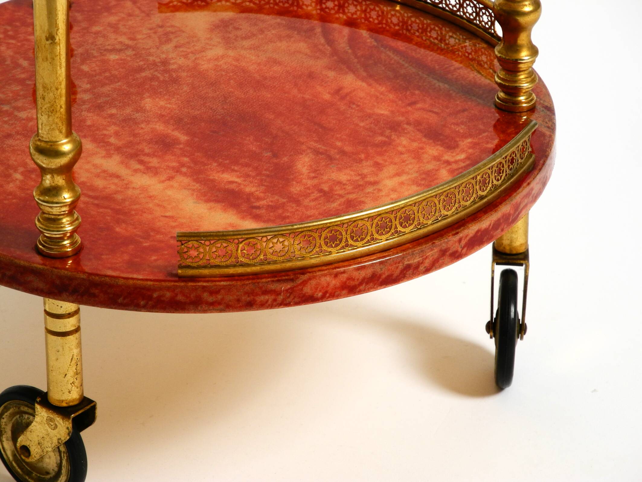 Round, small 1960s Aldo Tura serving or bar trolley in red goatskin leather