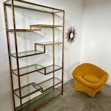 Old shelf in golden metal brass geometric library design 80s vintage