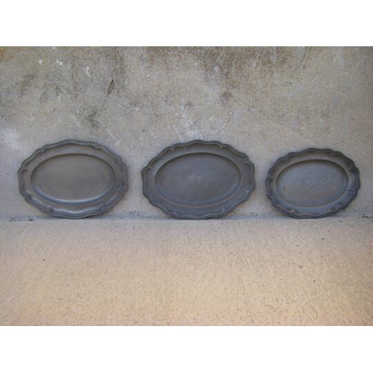 Three dishes in antique tin