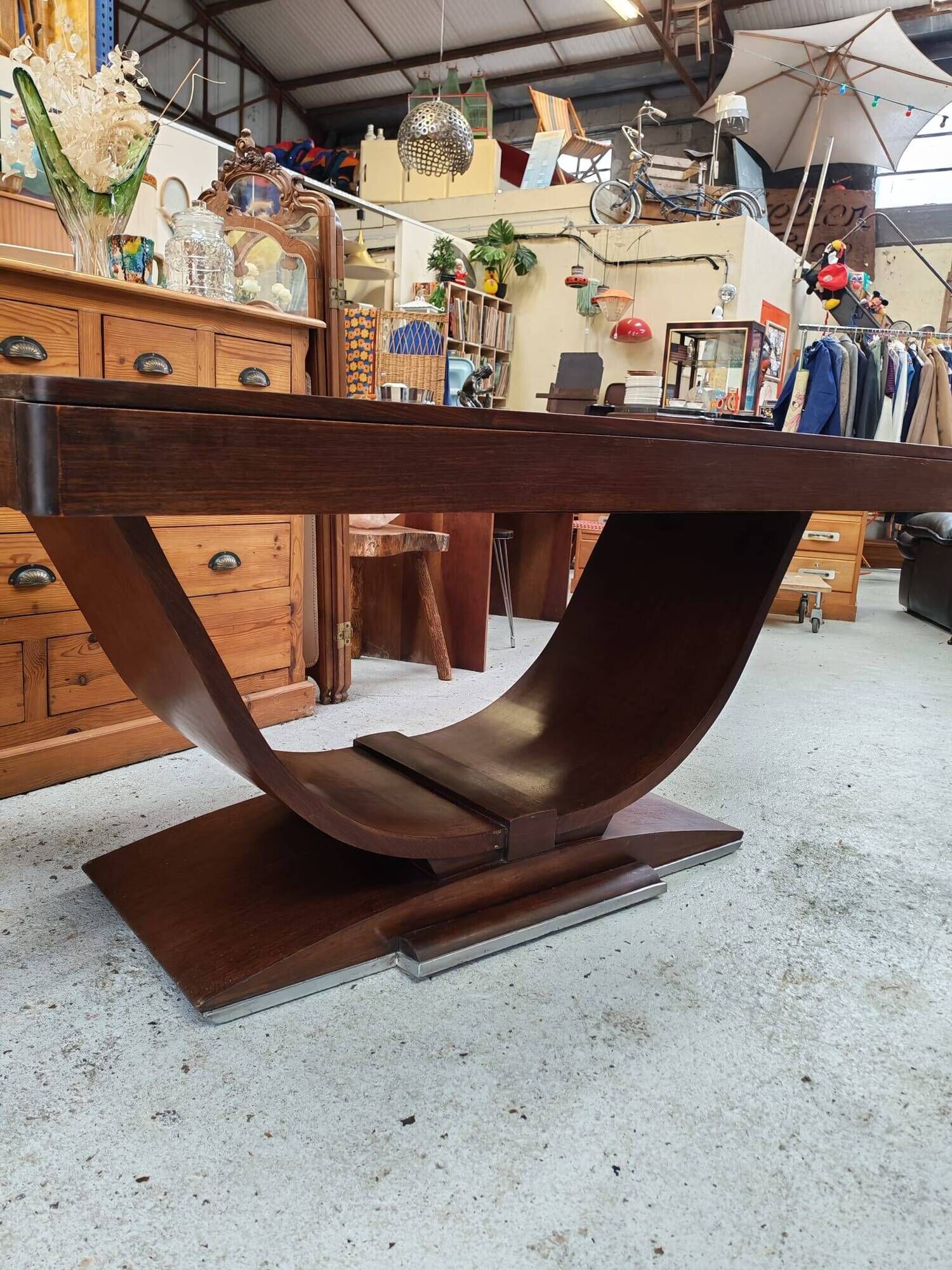 Art Deco dining table with a central cradle base from the 1930s.