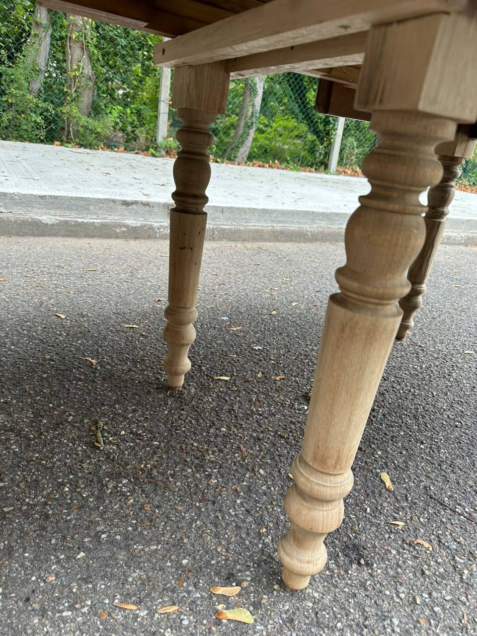 Round extendable dining table with flaps, stripped in raw oak, with 4 extensions.