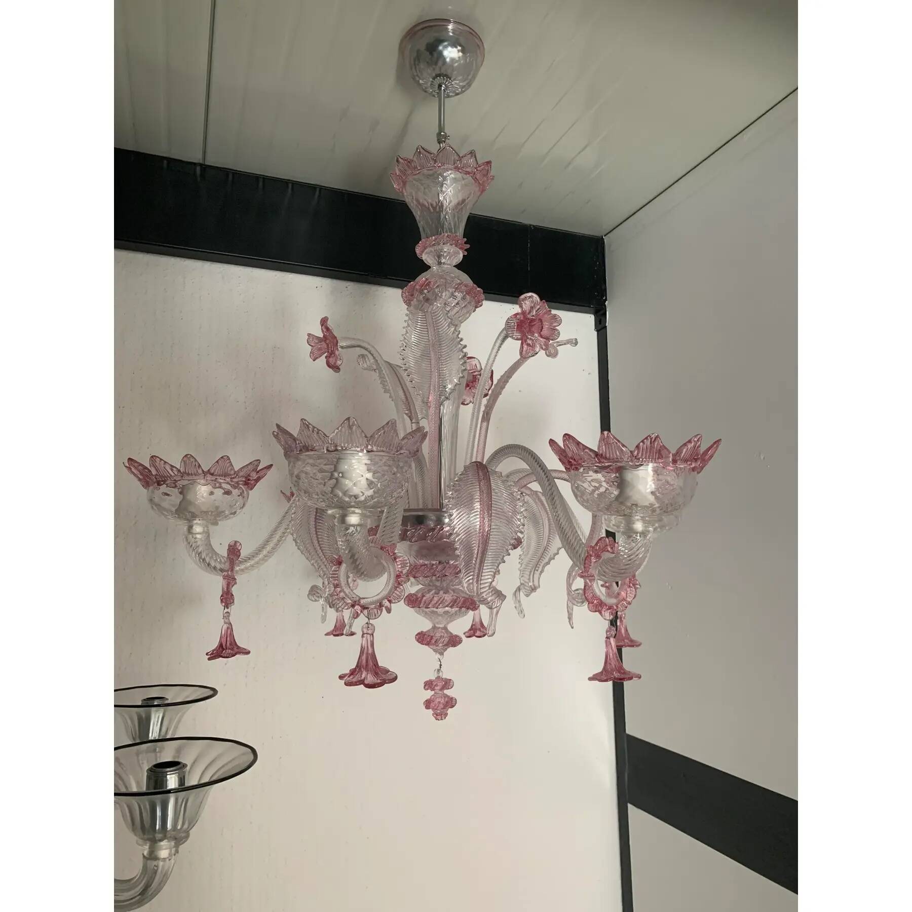 Chandelier in transparent and pink Murano-style glass with flower and leaf.