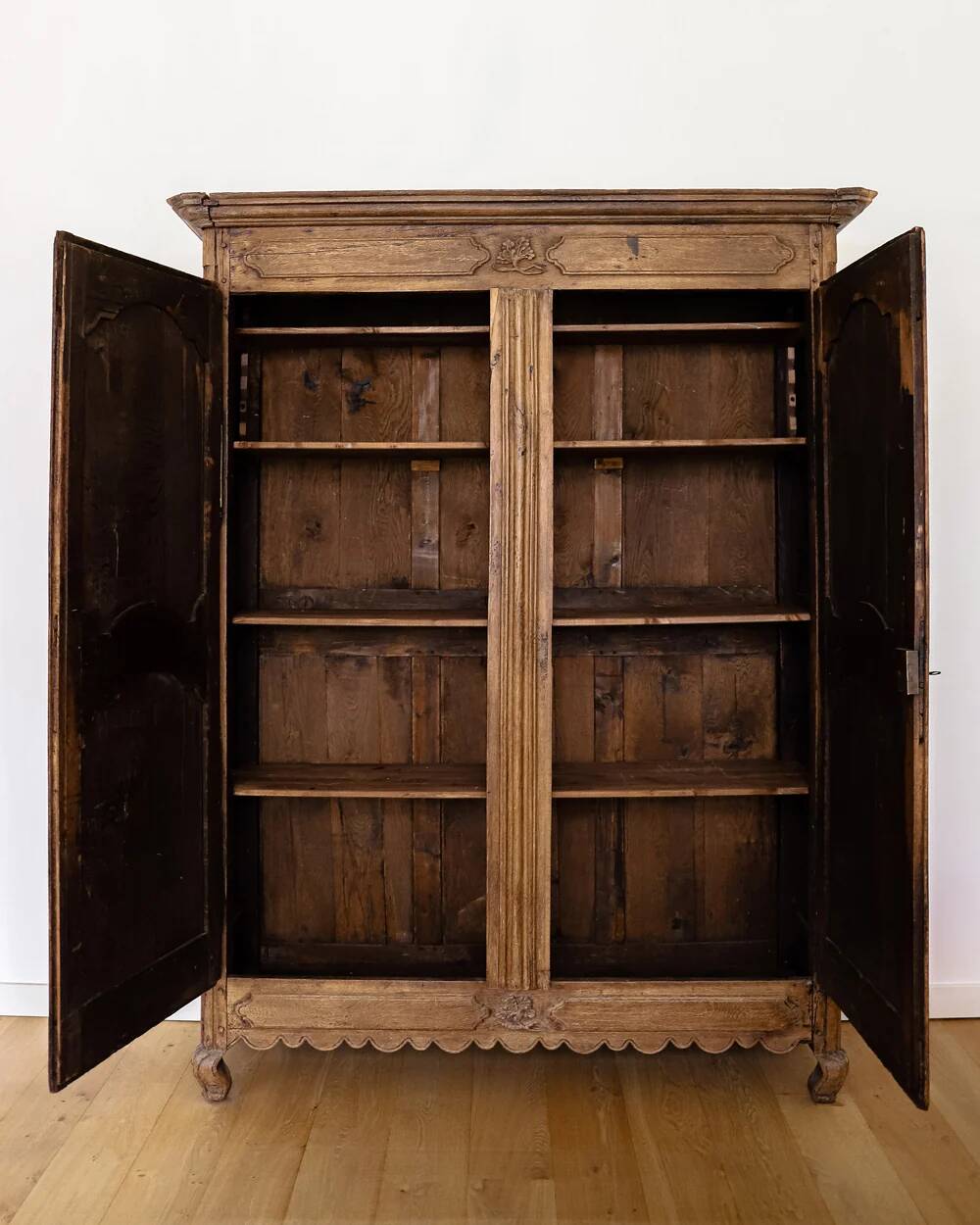 Antique French rustic wardrobe with star inlays.