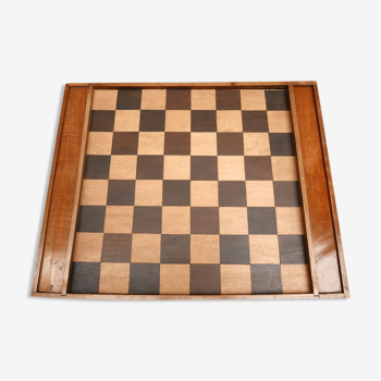 Old wooden checkers set and chessboard