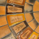 Round coffee table in ceramic and lacquered metal, Roger Capron