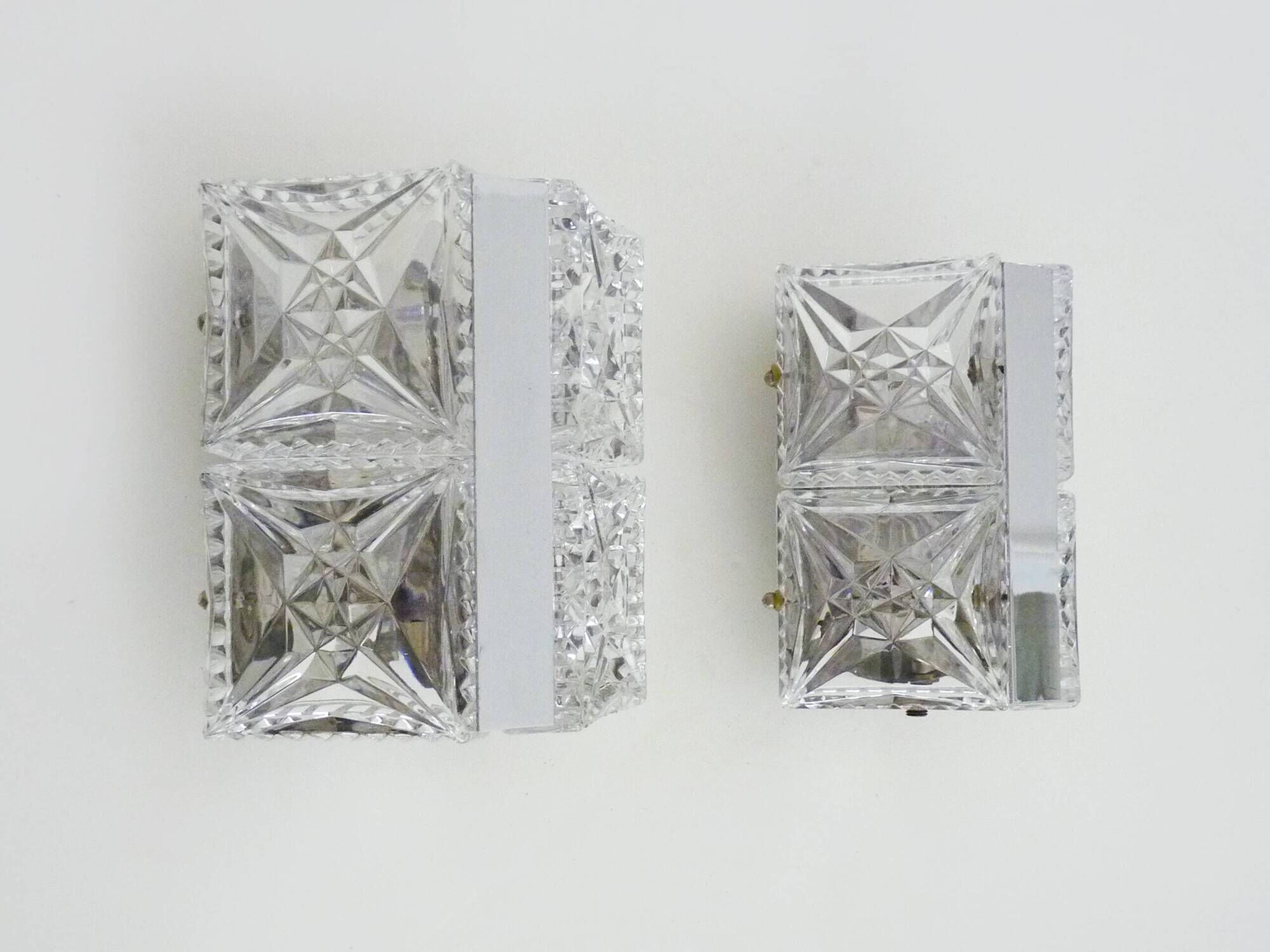 Pair of modernist 1970s glass and chrome metal wall sconces