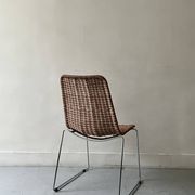 Chair design in rattan, woven wicker and chrome wire metal.