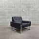 Pair of black leather armchairs