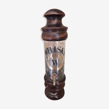 Vintage glass and wood whiskey bottle with pouring tap