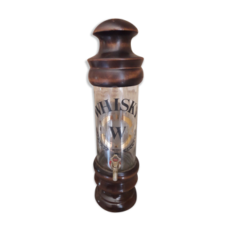 Vintage glass and wood whiskey bottle with pouring tap