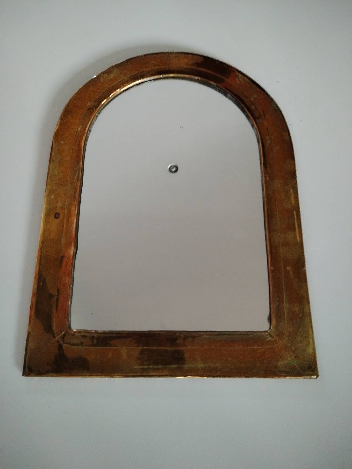 Old brass half moon mirror