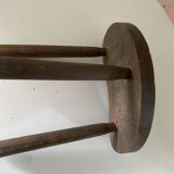 Antique tripod farm stool in brutalist style