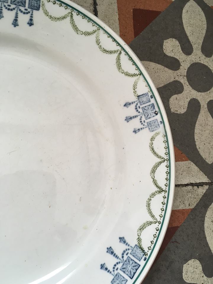 Together six dinner plates old mismatched bluish green.