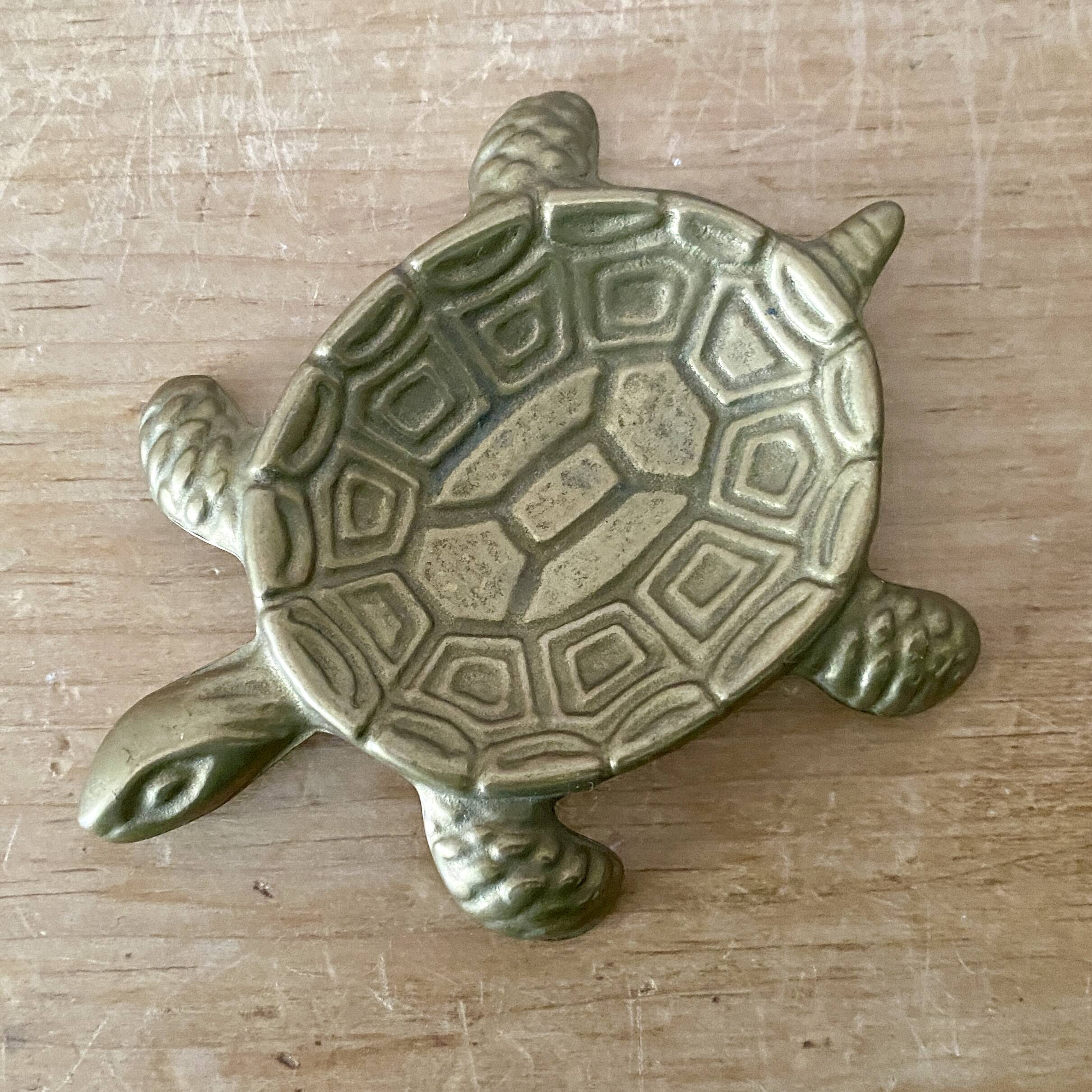 Vintage brass turtle pocket emptier