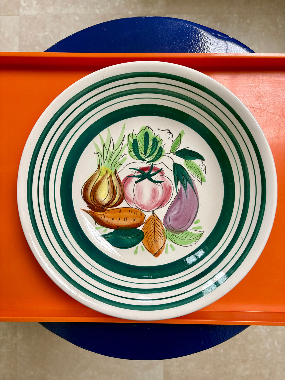 Vintage deep plate with vegetable decoration.