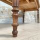 Vintage farmhouse table with turned legs.