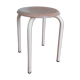 Industrial tubular metal stick sitting round in wood