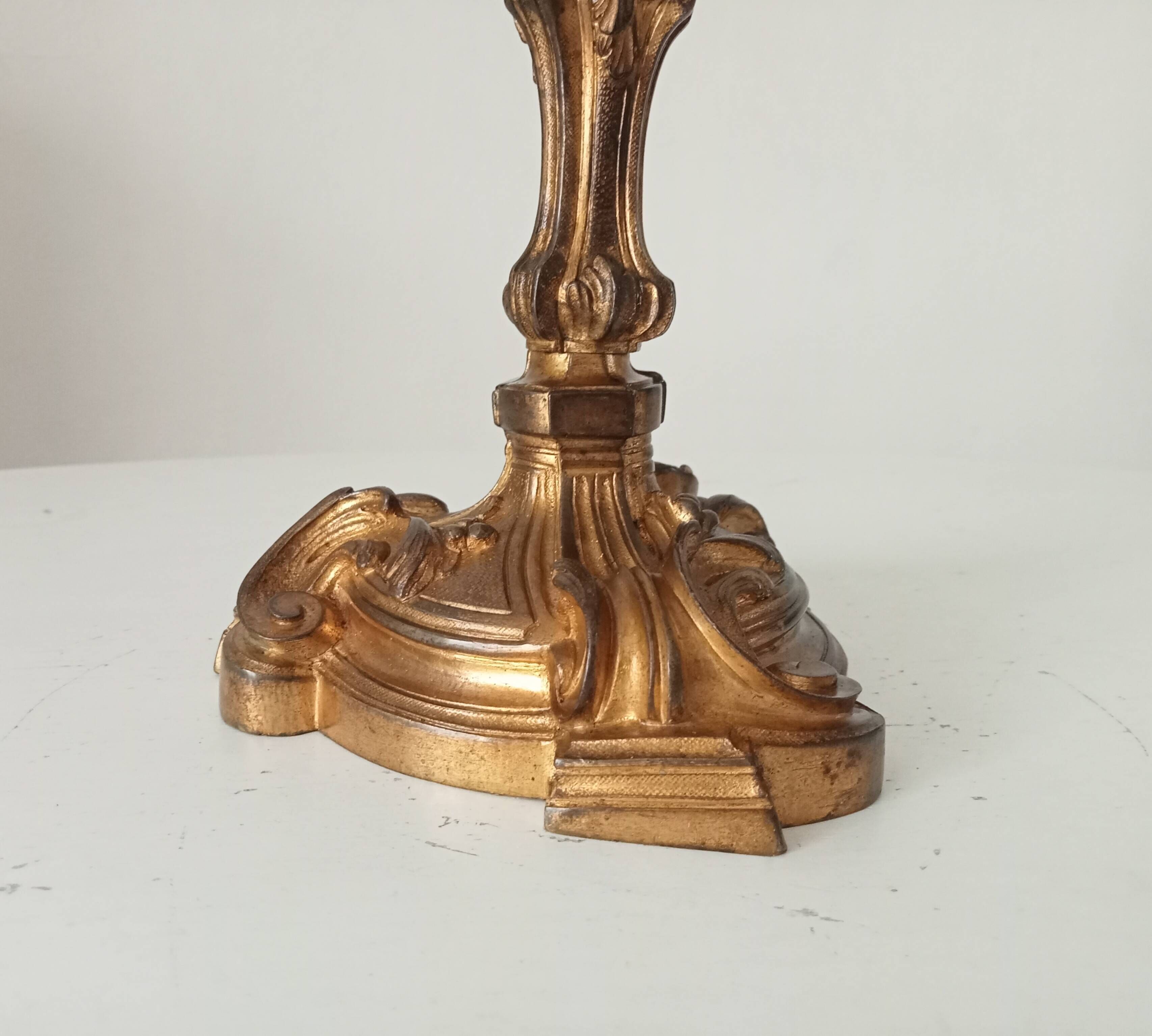 Antique 19th-century solid gilded bronze candlestick in the Louis XV style.