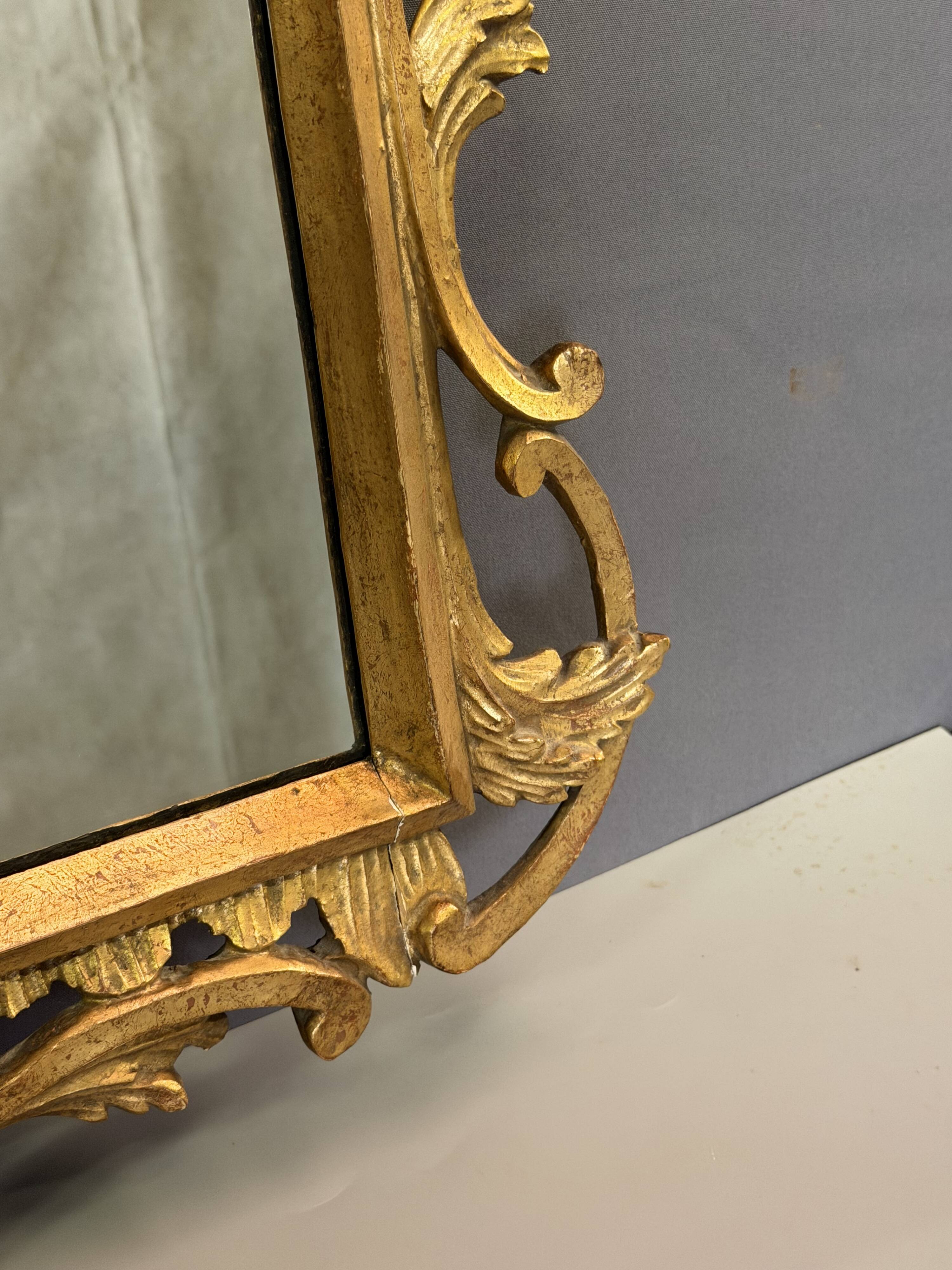 Italian mirror in gilded wood from the 19th century.