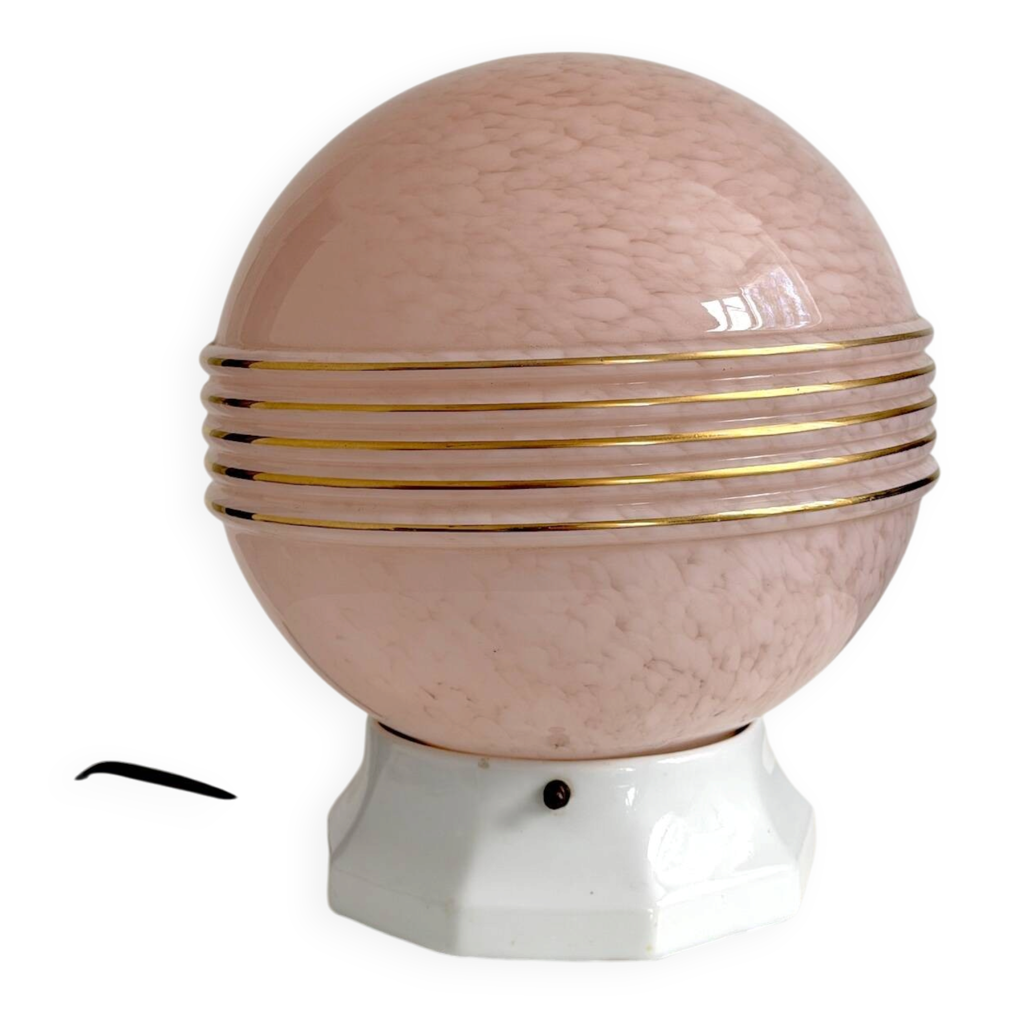 Art Deco lamp with a speckled pink glass globe and a white ceramic base.