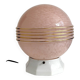 Art Deco lamp with a speckled pink glass globe and a white ceramic base.