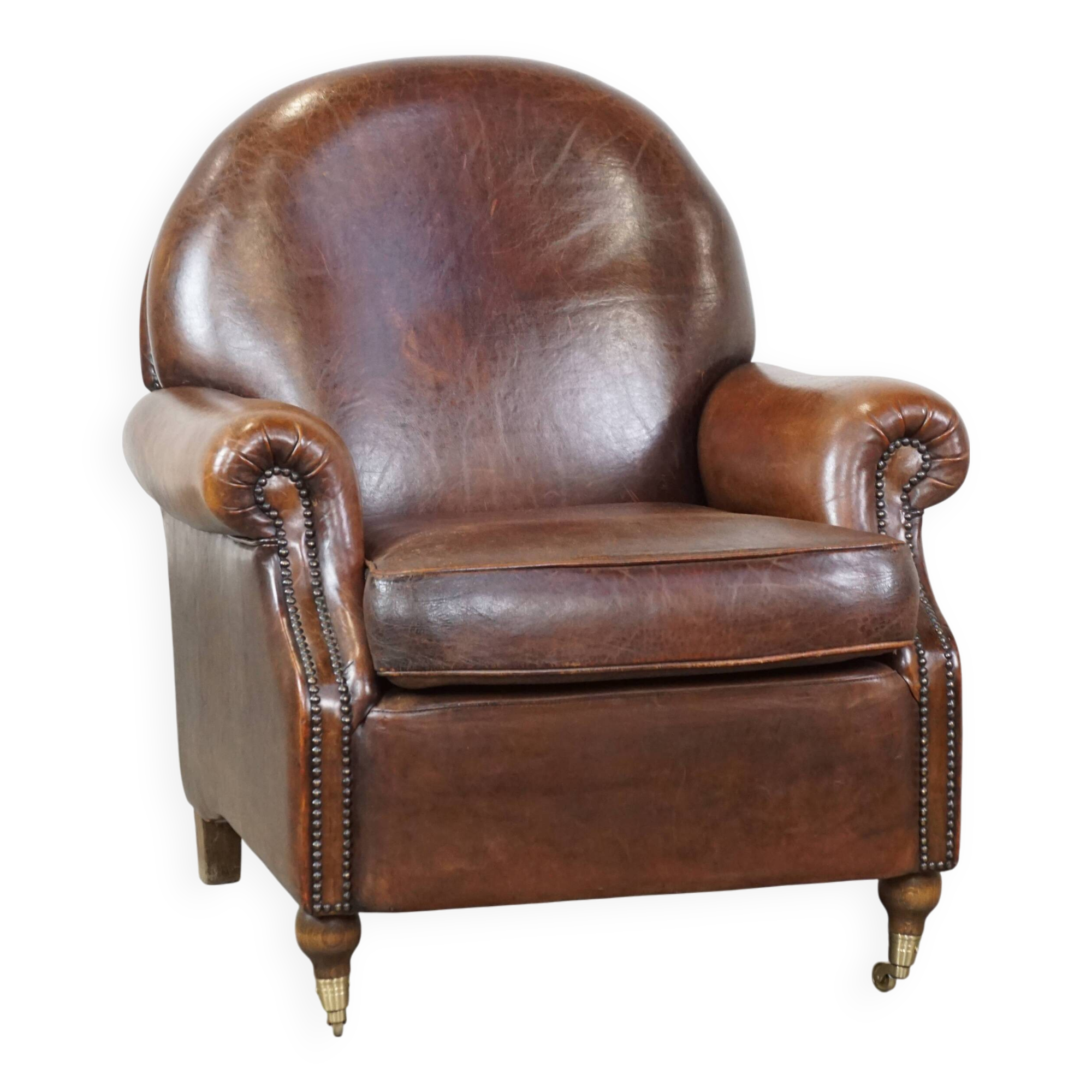 Sheep leather armchair on wheels