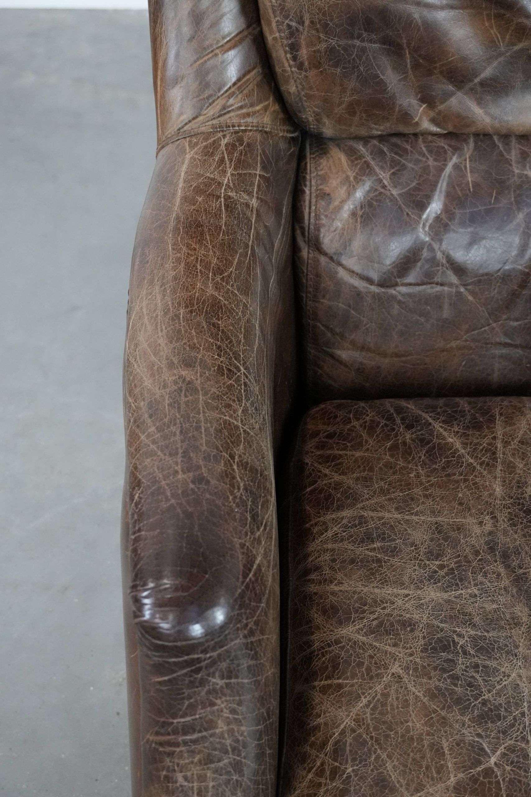 Very comfortable vintage cow leather armchair with beautiful colours