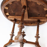 Round dining table of walnut with inlaid wood, 1890s