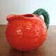 Orange pitcher in Corsican slip