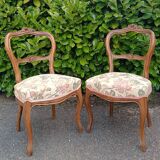 Pair of Louis XV chairs in carved walnut.