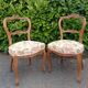 Pair of Louis XV chairs in carved walnut.