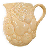 Vintage yellow pitcher in fruit slip