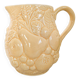 Vintage yellow pitcher in fruit slip