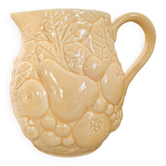 Vintage yellow pitcher in fruit slip