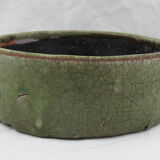 Bowl or empty pocket in cracked green sandstone varnish raku