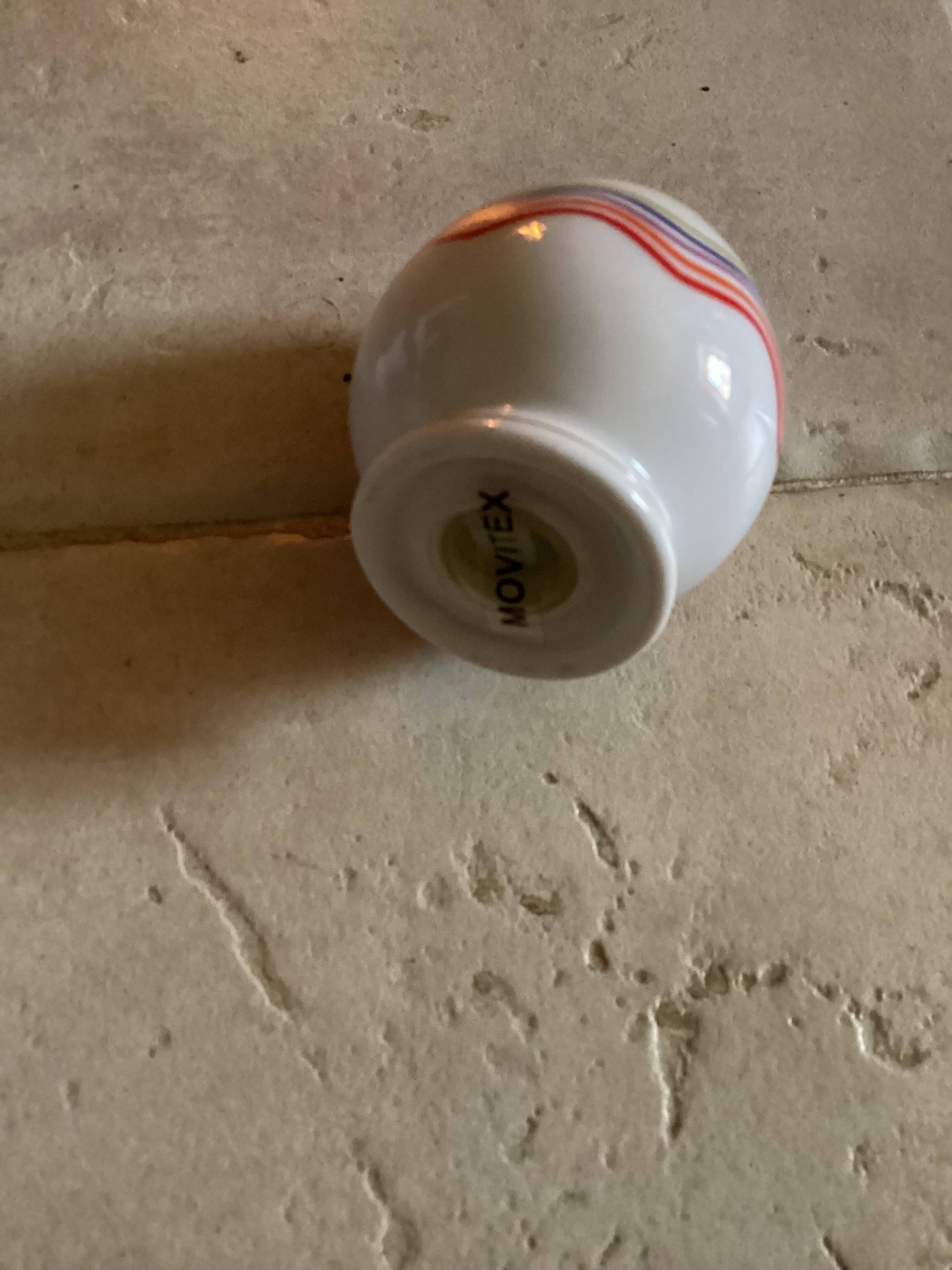 Set of 4 egg cups with their spoons, salt shaker, colored pepper shaker