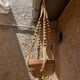 Suspension in macramé