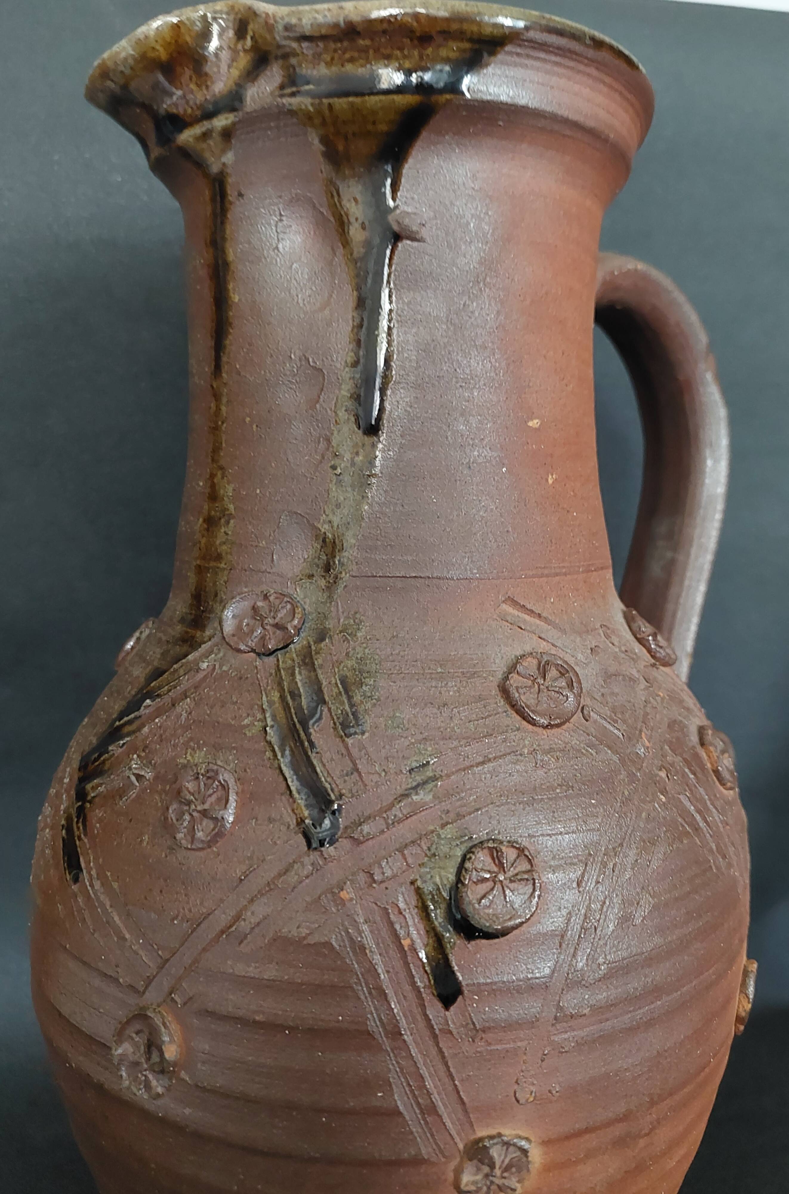 Vintage pitcher with a signature to identify.