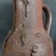 Vintage pitcher with a signature to identify.