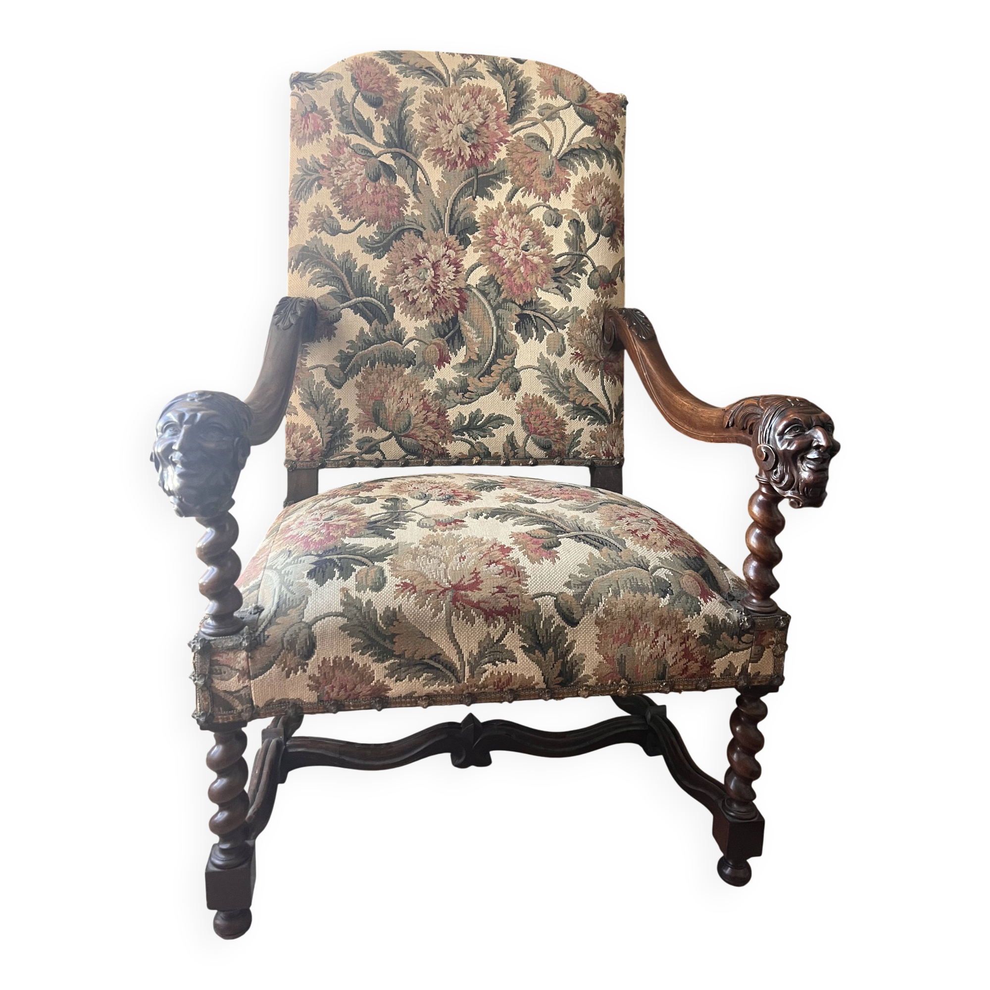 Antique armchair in Henri II style with masks