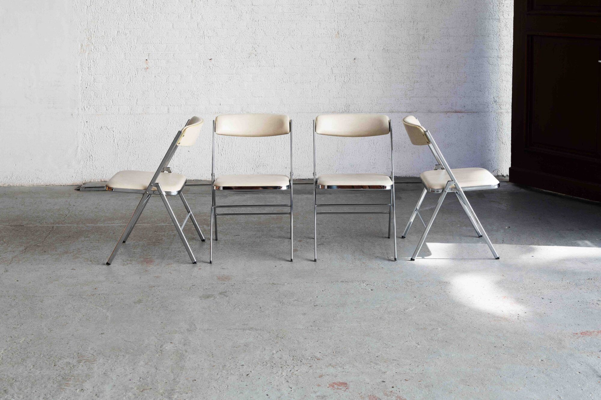 Set of 4 'Plia' dining chairs by Giancarlo Piretti