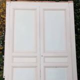 Pair of cupboard doors and old woodwork frame