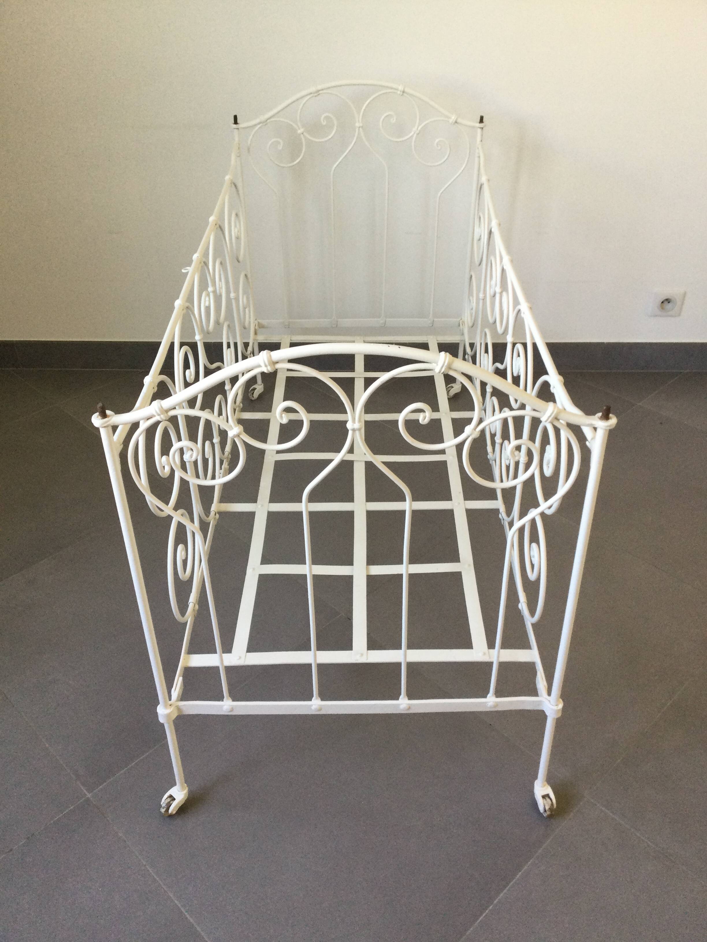 White wrought iron folding bed